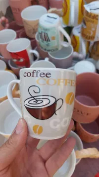 كوب قهوة سيراميك بتصميم كوفي