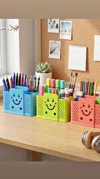 منظم أقلام بتصميم وجه مبتسم