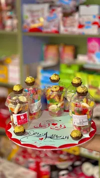 مجموعة حلويات أفراح - علب شفافة بشوكولاتة ذهبية